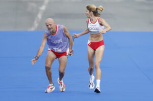 Athlete is stripped of their bronze medal on the final day of Paris Paralympics Games because she took her hand off the rope to help her guide after they cramped up just a metre before the finish line tiny
